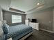 Comfortable bedroom with large bed, TV, and dresser at 5776 Newberry Pines Ave, Wesley Chapel, FL 33545