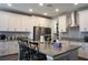 Modern kitchen with white cabinets and stainless steel appliances at 5776 Newberry Pines Ave, Wesley Chapel, FL 33545
