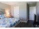 Bedroom with double door closet and hardwood floors at 5776 Newberry Pines Ave, Wesley Chapel, FL 33545