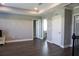 Spacious bonus room with hardwood floors and access to bedrooms at 5776 Newberry Pines Ave, Wesley Chapel, FL 33545