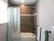Updated bathroom with a tub shower combination and neutral tile at 5776 Newberry Pines Ave, Wesley Chapel, FL 33545