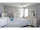 Bedroom with dresser, window, and ceiling fan at 5776 Newberry Pines Ave, Wesley Chapel, FL 33545