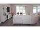 Spacious living room with sectional sofa and sliding glass doors at 5776 Newberry Pines Ave, Wesley Chapel, FL 33545
