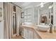 Elegant bathroom with white sink, beige countertop, and walk-in shower at 608 Armada S Rd, Venice, FL 34285