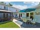 Inviting patio with outdoor seating and an umbrella, perfect for dining al fresco at 608 Armada S Rd, Venice, FL 34285