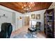 Spacious home office with hardwood floors, chandelier, and built-in shelving at 608 Armada S Rd, Venice, FL 34285