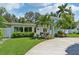 Charming light blue house with lush landscaping at 608 Armada S Rd, Venice, FL 34285