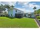 Large backyard with grassy area, gazebo, and patio furniture at 608 Armada S Rd, Venice, FL 34285