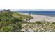 Beach access with boardwalk, lifeguard stand, and beachgoers enjoying the sand at 608 Armada S Rd, Venice, FL 34285