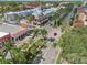 Aerial view of a town center with palm trees and Spanish-style architecture at 608 Armada S Rd, Venice, FL 34285