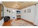 Comfortable bedroom with wood floors, and access to a full bathroom at 608 Armada S Rd, Venice, FL 34285