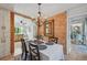 Dining room with chandelier, and view into kitchen at 608 Armada S Rd, Venice, FL 34285