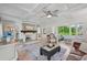 Open living space with a fireplace and sunroom at 608 Armada S Rd, Venice, FL 34285