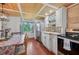 Bright kitchen with stainless steel appliances and wood floors at 608 Armada S Rd, Venice, FL 34285