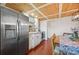 Bright kitchen with white cabinets, stainless steel appliances, and a wood ceiling at 608 Armada S Rd, Venice, FL 34285