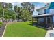 Spacious backyard with lush lawn and screened gazebo at 608 Armada S Rd, Venice, FL 34285