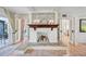 Whitewashed brick fireplace with built-in shelving at 608 Armada S Rd, Venice, FL 34285