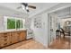 Galley-style kitchen with white cabinets and exposed brick at 608 Armada S Rd, Venice, FL 34285