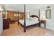 Main bedroom with king-size bed and wood accent wall at 608 Armada S Rd, Venice, FL 34285