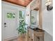 Bright entryway with a console table and mirror at 608 Armada S Rd, Venice, FL 34285