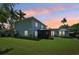 Serene backyard at dusk with gazebo and patio at 608 Armada S Rd, Venice, FL 34285