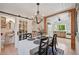 Open concept dining room with adjacent kitchen and bathroom at 608 Armada S Rd, Venice, FL 34285