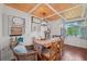 Cozy dining area with built-in bench seating and wood floors at 608 Armada S Rd, Venice, FL 34285