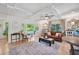 Bright living room with hardwood floors, a sofa, and a coffee table at 608 Armada S Rd, Venice, FL 34285