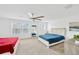 Bright bedroom with two beds and ceiling fan at 19336 Eagle Creek Ln, Tampa, FL 33647