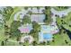 Aerial view showcasing community amenities, including tennis courts, playground, and swimming pool at 2118 Harbour Watch Dr, Tarpon Springs, FL 34689