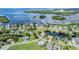 Aerial view of waterfront community with houses and canals at 2118 Harbour Watch Dr, Tarpon Springs, FL 34689