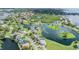 Aerial view showing waterfront property and lush landscape at 2118 Harbour Watch Dr, Tarpon Springs, FL 34689