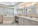 Elegant bathroom with corner soaking tub and double vanity at 2118 Harbour Watch Dr, Tarpon Springs, FL 34689