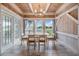 Bright dining area with large windows and water views at 2118 Harbour Watch Dr, Tarpon Springs, FL 34689