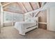 Spacious bedroom with vaulted ceilings and large windows at 2118 Harbour Watch Dr, Tarpon Springs, FL 34689