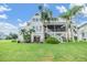 Two-story house with a large backyard at 2118 Harbour Watch Dr, Tarpon Springs, FL 34689