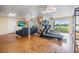 Finished basement with home gym, TV area, and stunning lake views at 2118 Harbour Watch Dr, Tarpon Springs, FL 34689