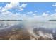 Scenic waterfront view with calm water and blue sky at 2118 Harbour Watch Dr, Tarpon Springs, FL 34689