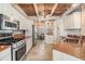 Spacious kitchen with island, stainless steel appliances, and wood ceiling at 2118 Harbour Watch Dr, Tarpon Springs, FL 34689