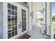Front porch with double doors and a welcoming entrance at 2118 Harbour Watch Dr, Tarpon Springs, FL 34689