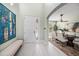 Bright entryway with high ceilings, white door, and a seating bench at 404 Bahama Grande Blvd, Apollo Beach, FL 33572