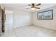 Well-lit bedroom featuring tile flooring and a window at 5357 81St N St # 1, St Petersburg, FL 33709