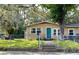 Charming house with a teal door and well-maintained lawn at 1313 E New Orleans Ave, Tampa, FL 33603