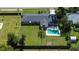 Aerial view of house with a fenced backyard and swimming pool at 1034 S Mount Carmel Rd, Brandon, FL 33511