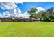 Large backyard with brick home and a pool at 1034 S Mount Carmel Rd, Brandon, FL 33511