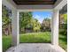 Backyard with a view of a tranquil river framed by white columns, offering a serene outdoor experience at 321 W Hanlon St, Tampa, FL 33604