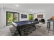 Spacious finished basement with pool table and bar area, perfect for recreation and relaxation at 321 W Hanlon St, Tampa, FL 33604