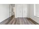 Spacious bedroom featuring wood floors, closet, and modern white trim at 321 W Hanlon St, Tampa, FL 33604