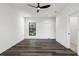 Bright bedroom featuring wood floors and window view at 321 W Hanlon St, Tampa, FL 33604