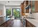 Modern kitchen with island, wood cabinets and sliding glass doors at 321 W Hanlon St, Tampa, FL 33604